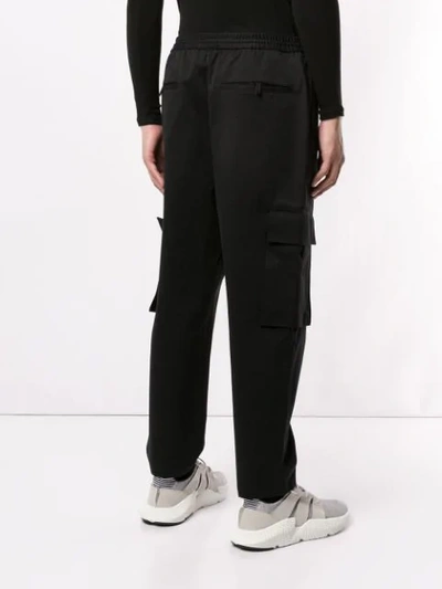 Shop Juunj Utility Trousers In Black