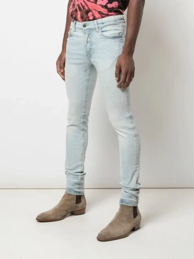 Shop Amiri Stack Skinny Jeans In Blue