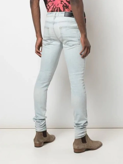 Shop Amiri Stack Skinny Jeans In Blue