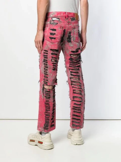 Shop Gucci Ripped Jeans In Red