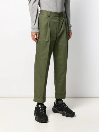 Shop Acne Studios Cuffed Hem Pleated Trousers In Green