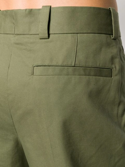 Shop Acne Studios Cuffed Hem Pleated Trousers In Green