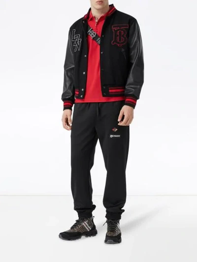 Shop Burberry Contrast Sleeve Logo Graphic Bomber Jacket In Black