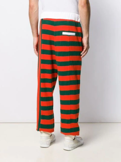 Shop Loewe Stripe Jersey Trousers In Orange