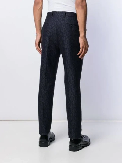 Shop Fendi Logo Pattern Tailored Trousers In Blue