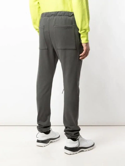 Shop Fear Of God Track Pants With Oversized Features In Green