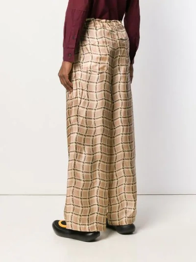 Shop Marni Patterned Loose-fit Trousers In Neutrals