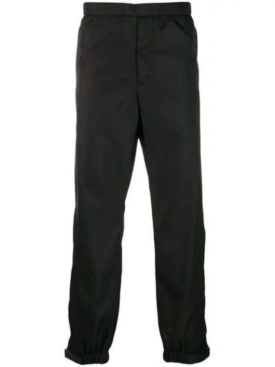 Shop Prada Elasticated Waist Strap Trousers In Black