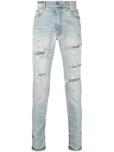 Shop Amiri Distressed Detail Jeans In Blue
