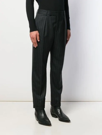 Shop Saint Laurent Striped Tailored Trousers In Black