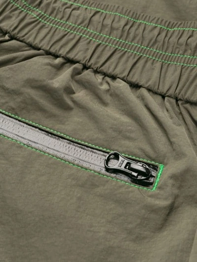 Shop John Elliott Nylon Trackpants In Green