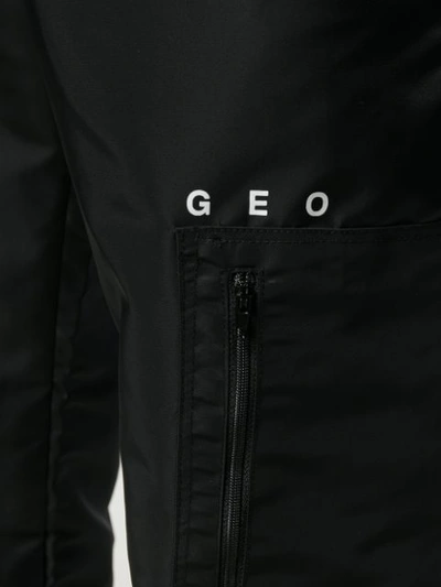 Shop Geo Ny Track Pants In Black