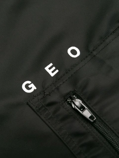 Shop Geo Ny Track Pants In Black