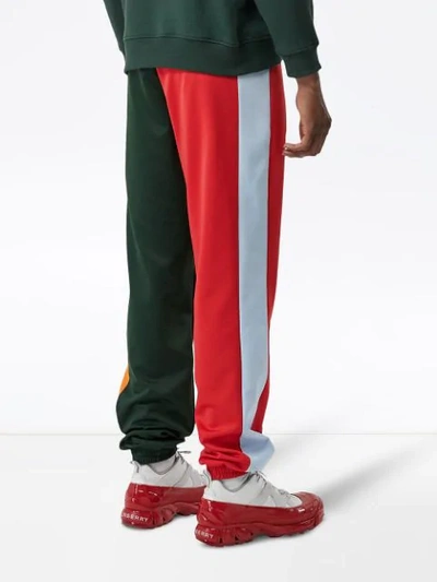 Shop Burberry Logo Graphic Colour Block Jersey Trackpants In Green