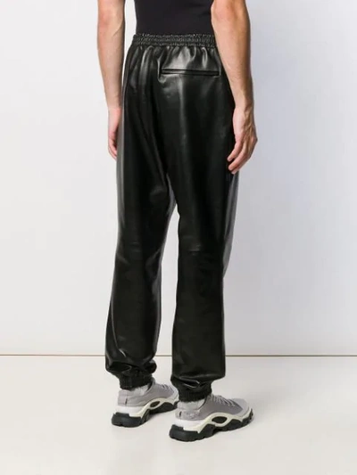 Shop Burberry Elasticated Hem Leather Trousers In Black