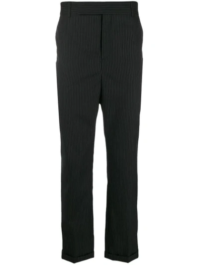 Shop Saint Laurent Pinstriped Tapered Trousers In Black