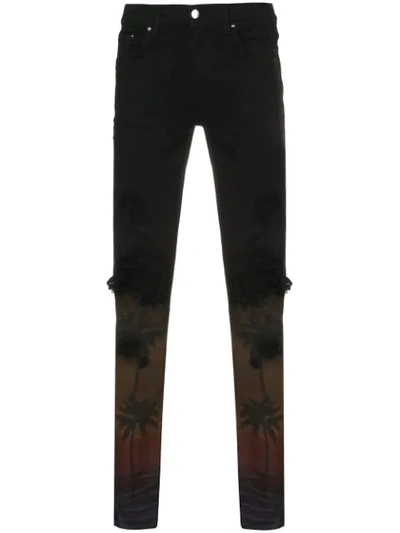 Shop Amiri Palm Trees Skinny Jeans - Black