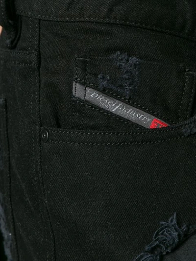 Shop Diesel Ripped Effect Jeans In Black