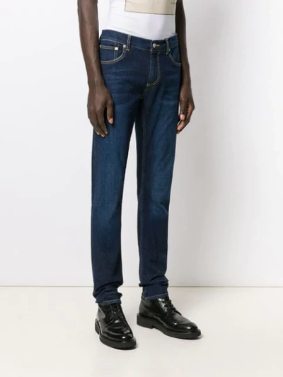 Shop Alexander Mcqueen Logo-embroidered Slim-fit Jeans In Blue