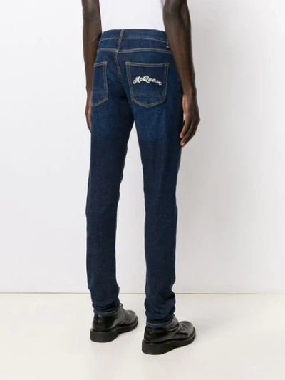 Shop Alexander Mcqueen Logo-embroidered Slim-fit Jeans In Blue