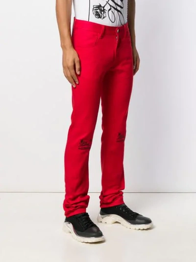 Shop Raf Simons Slim-fit Embroidered Knee Jeans In Red