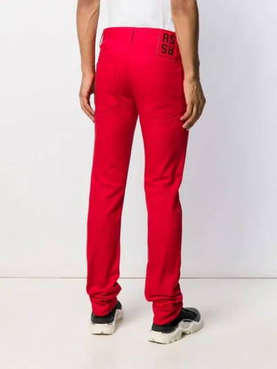 Shop Raf Simons Slim-fit Embroidered Knee Jeans In Red