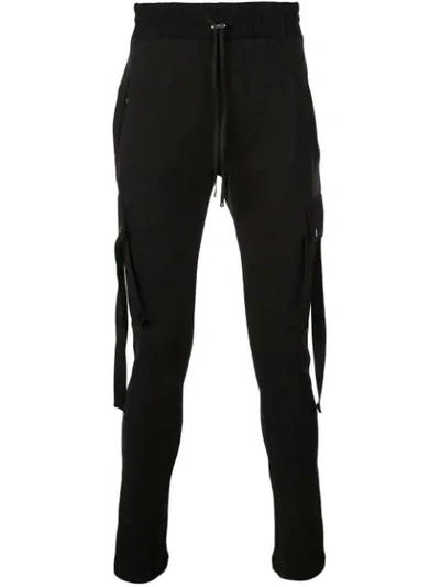 Shop Amiri Tapered Track Pants In Black