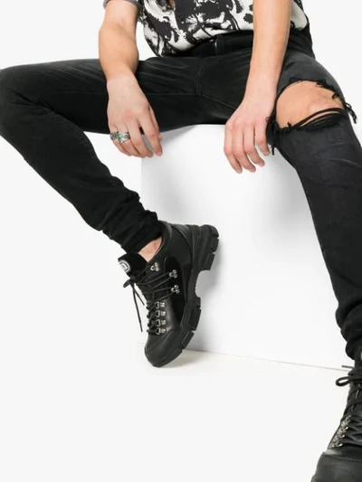Shop Amiri Ripped Skinny Jeans In Black
