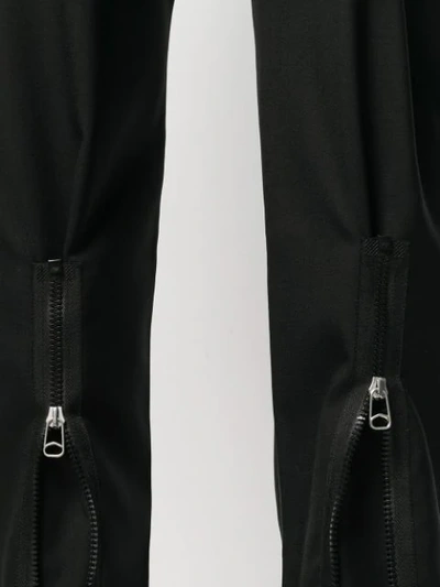 Shop Oamc Zip Leg Cropped Trousers In Black