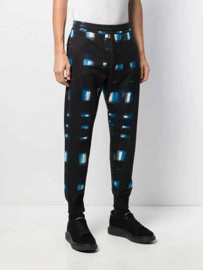 Shop Alexander Mcqueen Printed Tapered Track Trousers In Blue