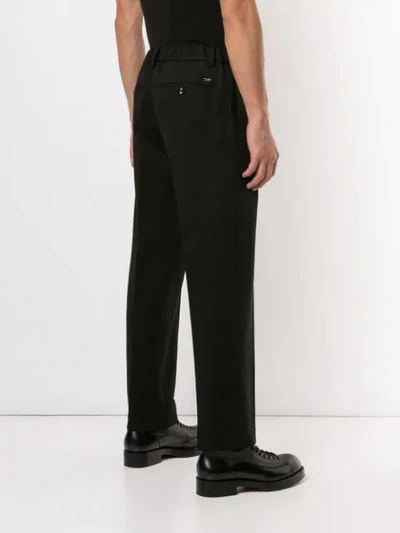 Shop Emporio Armani Tapered Tailored Trousers In Black
