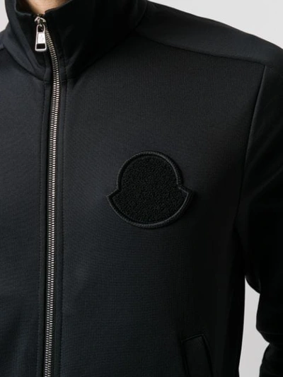 Shop Moncler Logo Patch Zipped Sweatshirt In Black