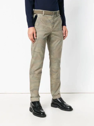 Shop Sacai Camouflage Print Trousers In Green