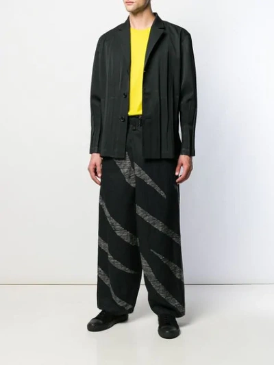 Shop Issey Miyake Striped Loose Trousers In Black