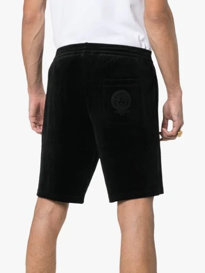 Shop Versace Logo Embroidered Cotton Blend Velvet Shorts In Black