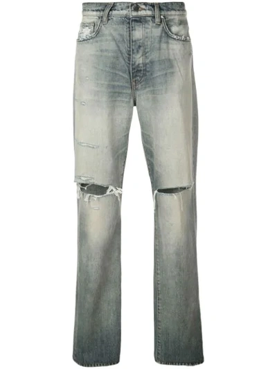 Shop Amiri Thrasher Slash Knee Jeans In Blue