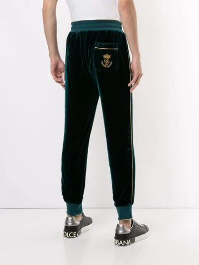 Shop Dolce & Gabbana Embroidered Crest Track Pants In Green