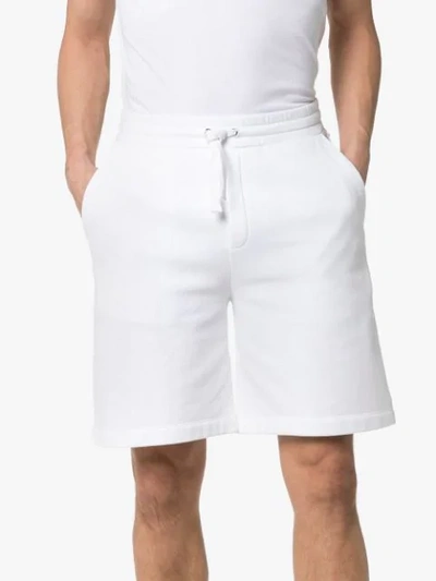 Shop Valentino Rockstud Track Shorts In White
