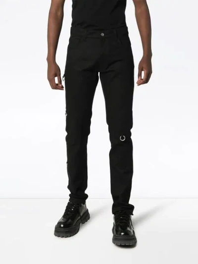 Shop Raf Simons Ring Detail Slim-fit Jeans In Black
