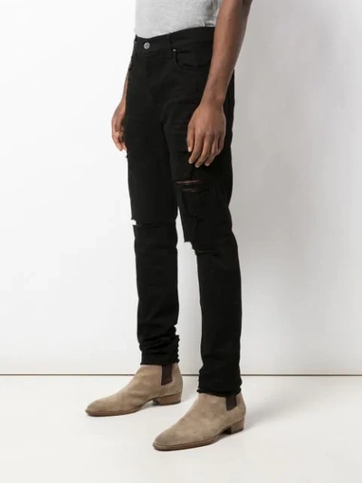 Shop Amiri Distressed Slim Fit Jeans In Black