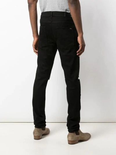 Shop Amiri Distressed Slim Fit Jeans In Black