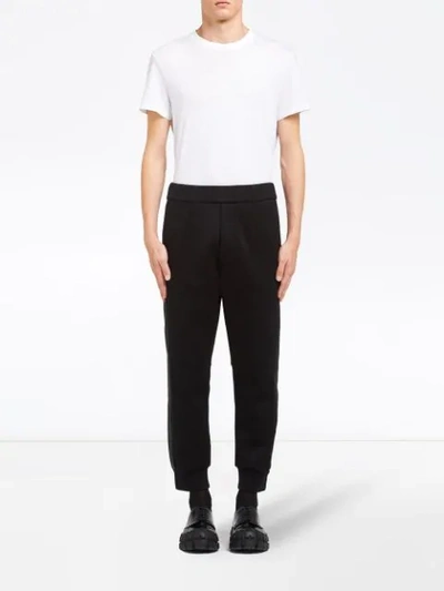 Shop Prada Zipped Cuff Track Trousers In Black