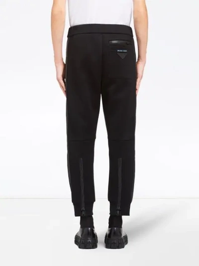 Shop Prada Zipped Cuff Track Trousers In Black