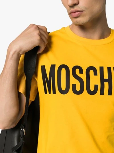 Shop Moschino Logo T-shirt In Yellow