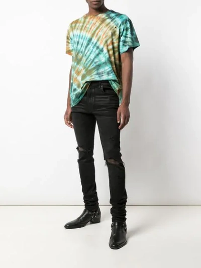 Shop Amiri Trasher Distressed Jeans In Black