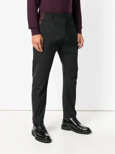 Shop Prada Side Stripe Trousers In Black