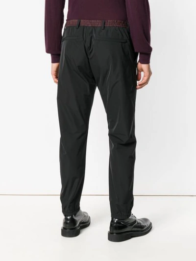 Shop Prada Side Stripe Trousers In Black