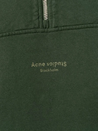 Shop Acne Studios Inverted Logo Zipped Polo Sweater In Green