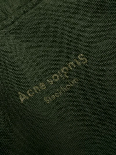 Shop Acne Studios Inverted Logo Zipped Polo Sweater In Green