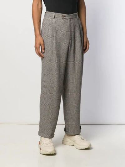 Shop Gucci Loose-fit Check Trousers In Black